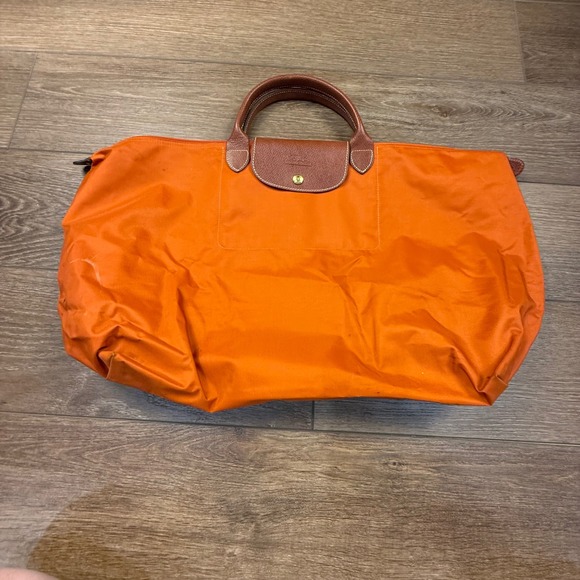 Longchamp Handbags - Longchamp Le Pliage Large Travel Weekender Tote Orange Leather Fair Condition